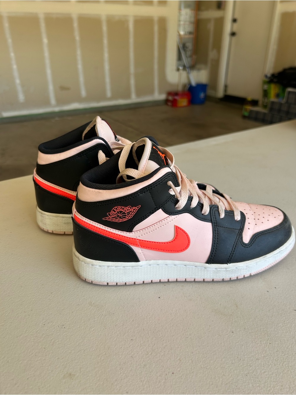 Nike Kids Black and Pink Mid-Top Sneakers with Coral Swoosh